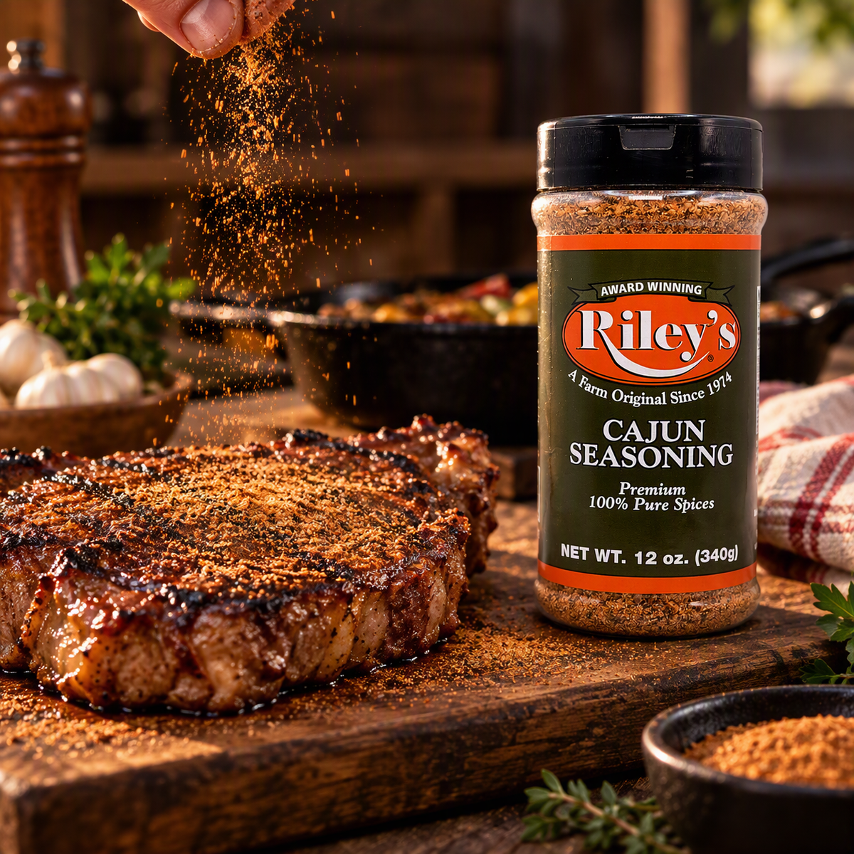Riley's Cajun Seasoning 12 oz beside a seasoned ribeye on a rustic cutting board